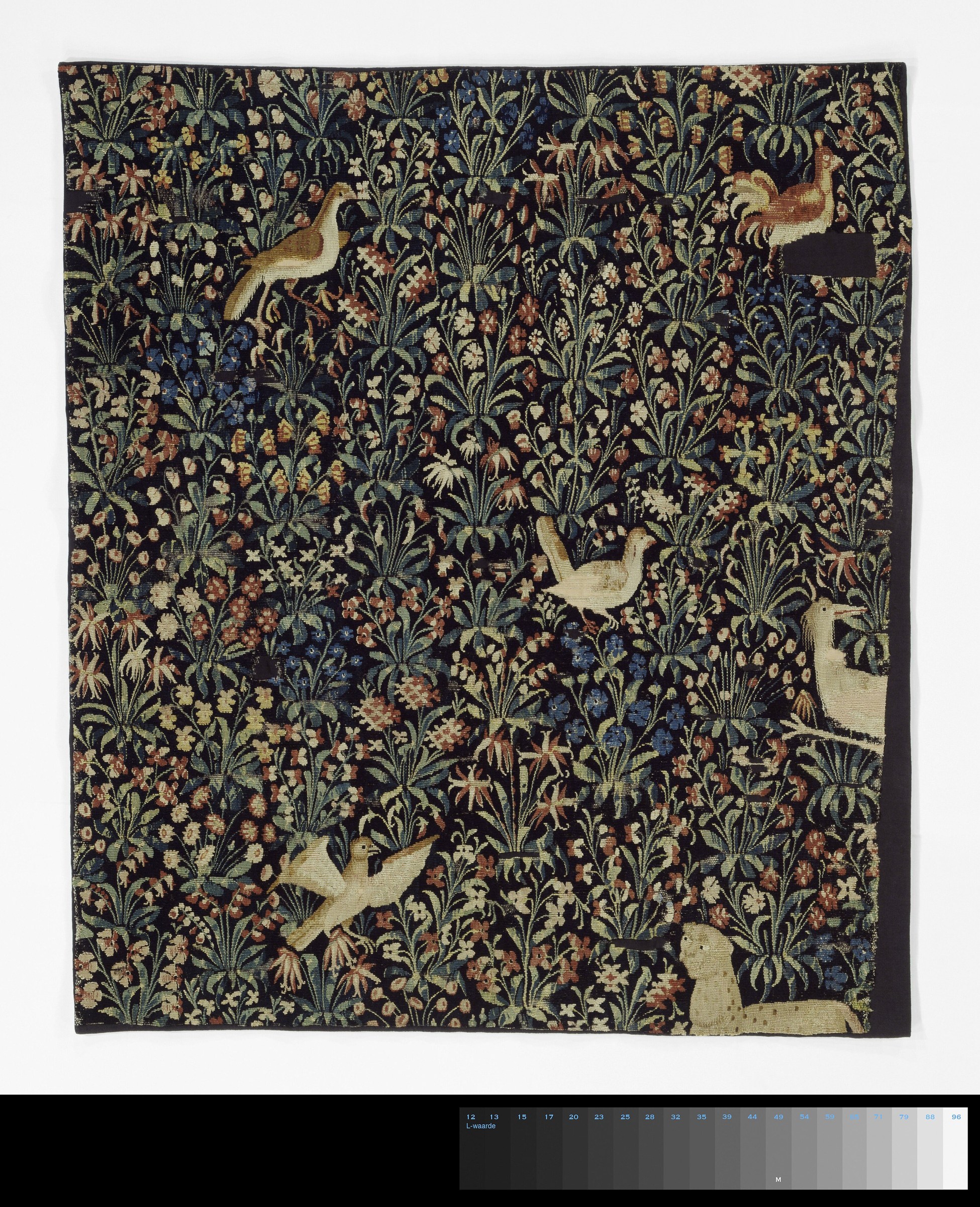Millefleurs tapestry fragment filled with small animals and flowers
