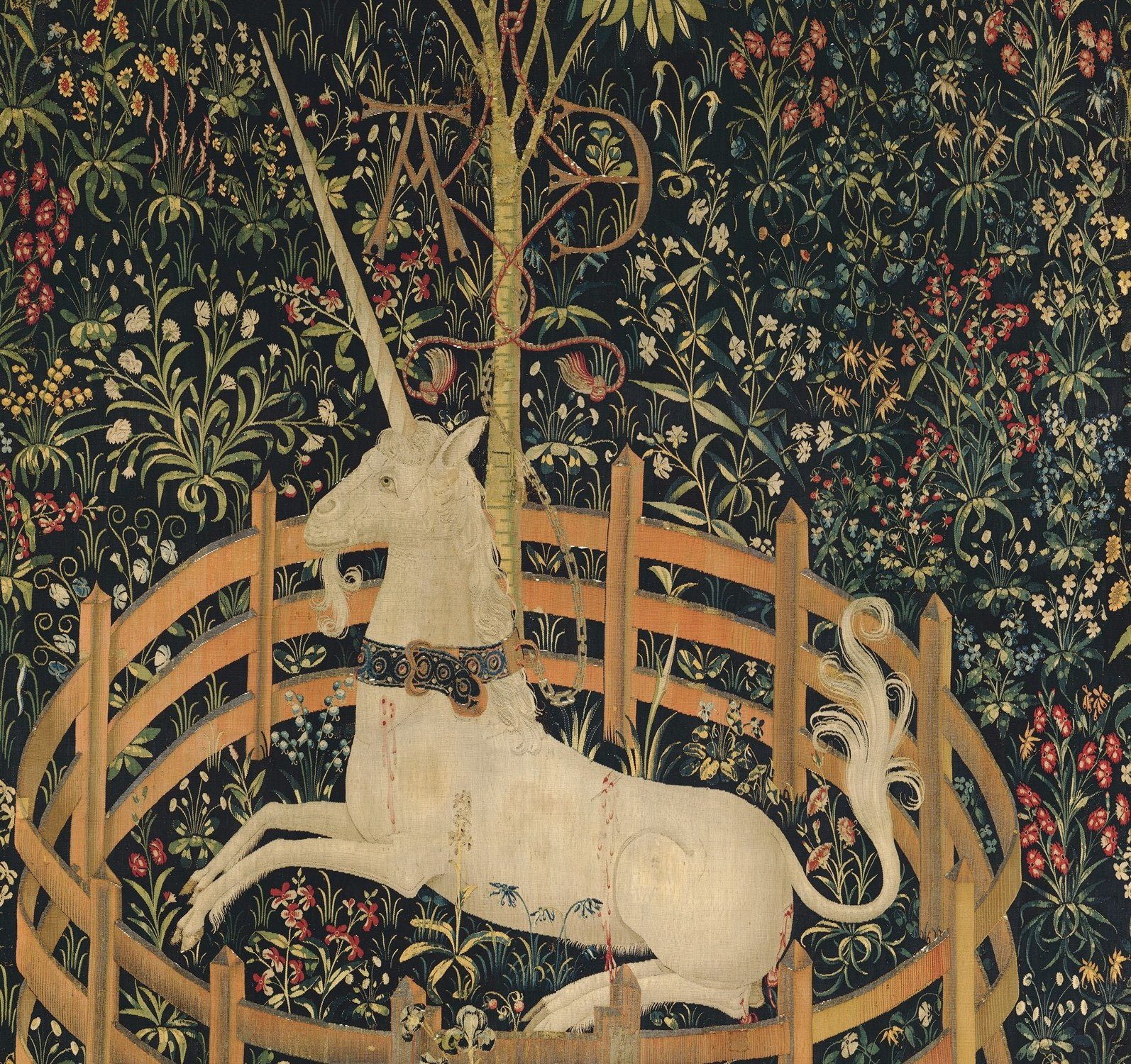 Editorial detail crop showing the unicorn’s collar, chain, pomegranate tree, and separate fence